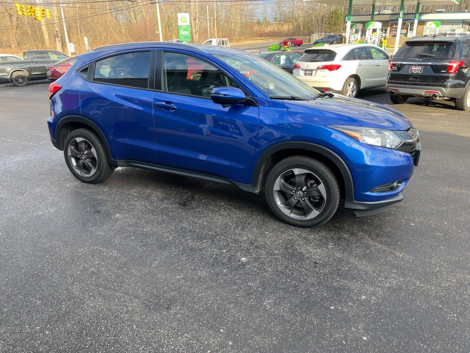 2018 Blue /Black Honda HR-V EX-L w/Navigation 4WD CVT (3CZRU6H71JM) with an 1.8L I4 DOHC 16V engine, Automatic transmission, located at 11115 Chardon Rd. , Chardon, OH, 44024, (440) 214-9705, 41.580246, -81.241943 - This 2018 Honda HR-V equipped with AWD (All Wheel Drive) and a 1.8L engine paired with a CVT (Continuously Variable Transmission) offers a blend of performance and efficiency. Its luxurious leather interior, complemented by heated seats and an automatic climate control system, ensures a comfortable - Photo #3